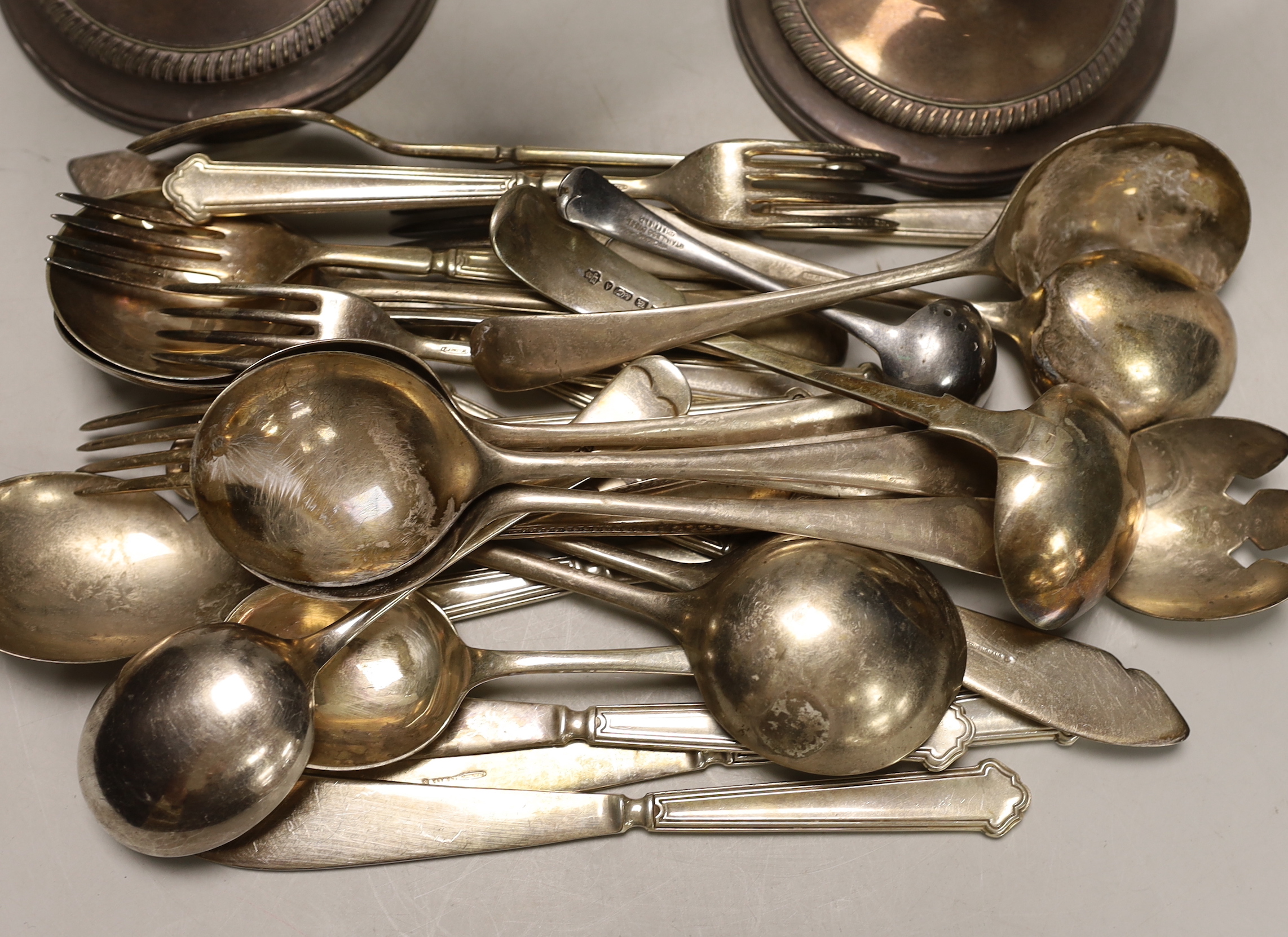 A pair of plated dwarf candelabra and a quantity of assorted plated flatware